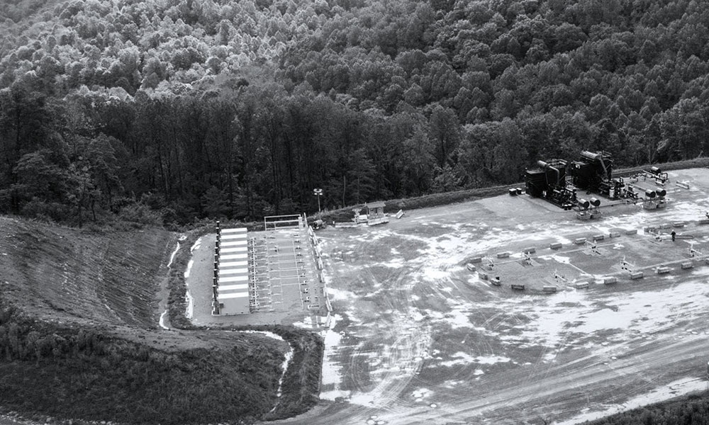 Large oil field in the middle of a forest